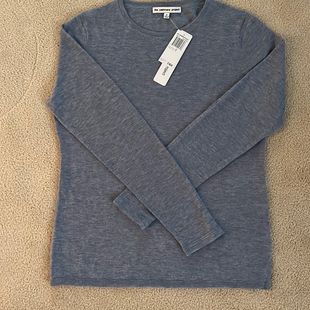 Indigo Heather crew neck cashmere sweater.the color is a bluish grey.